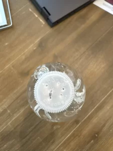 The bottom of a plastic water bottle, showing the holes we punctured into it.