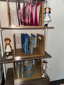 three wooden and acrylic boxes representing a simple homeschool organization system