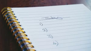 a spiral notepad with "Today" handwritten along with numbers 104.