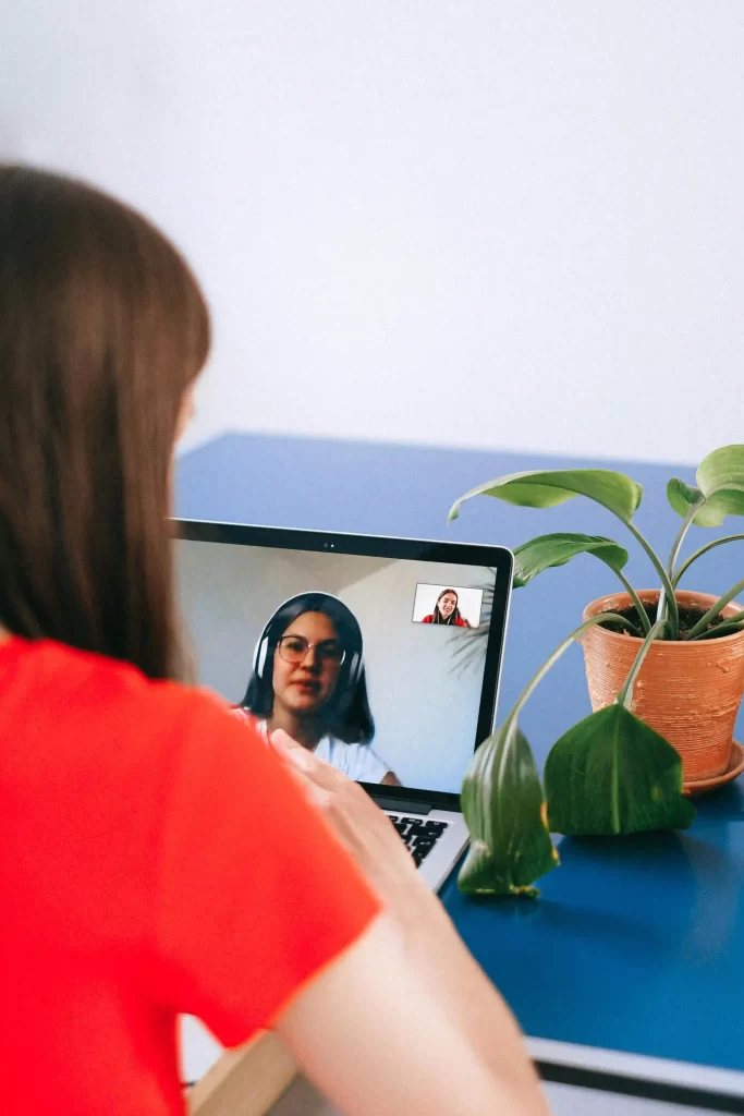 Two women having a virtual meeting.