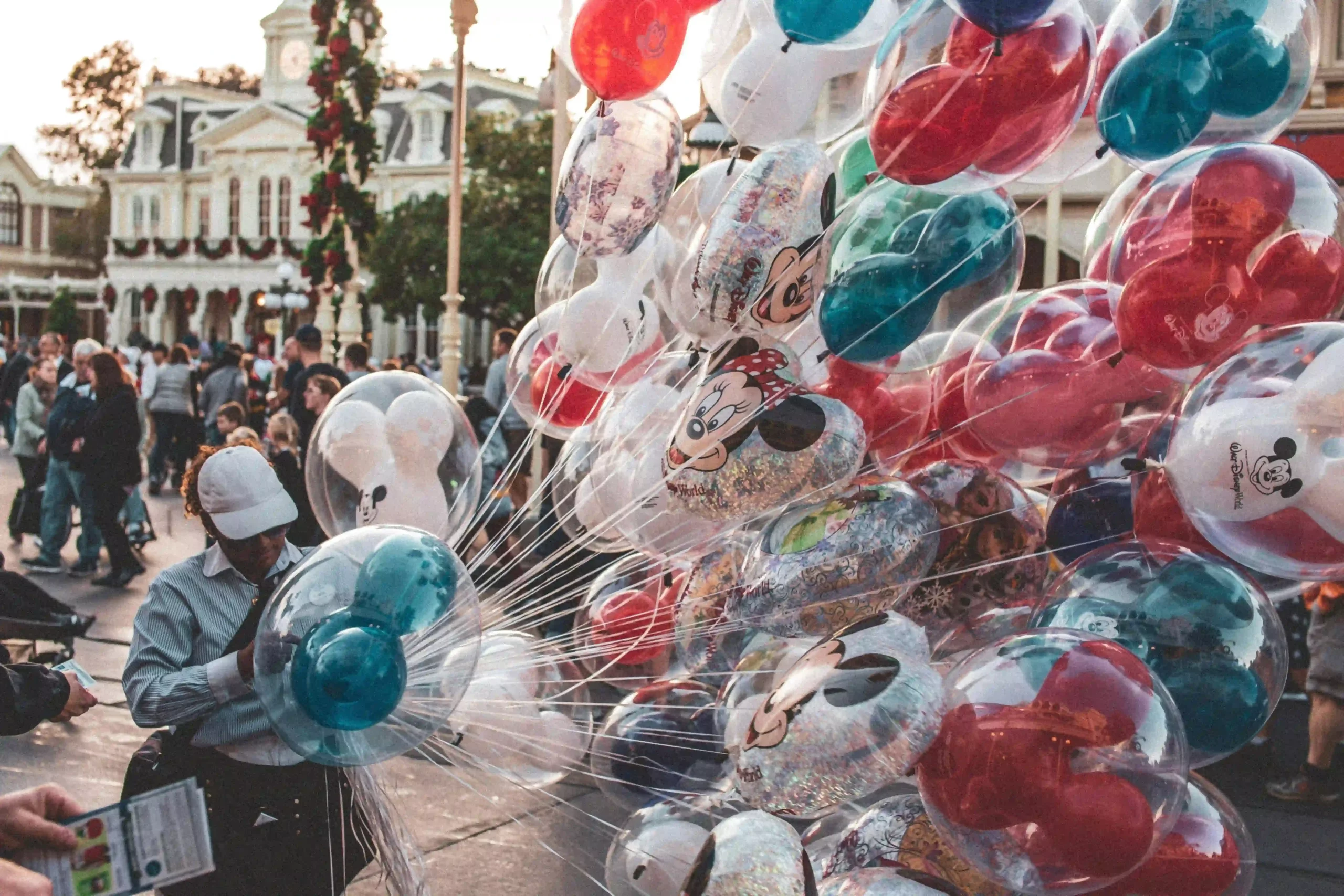 A large handful of balloons at Disney World representing how homeschooling families can create learning opportunities during vacation