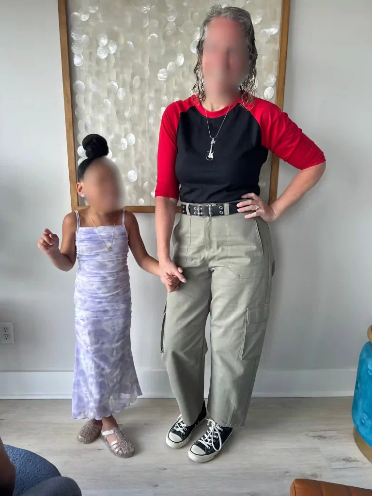 A girl and woman holding hands, wearing Freaky Friday-inspired outfits, representing Freaky Friday outfits.